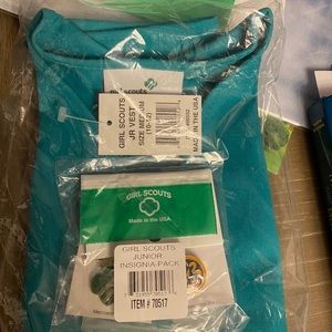 Brand new Girl Scout vest and patches/pin